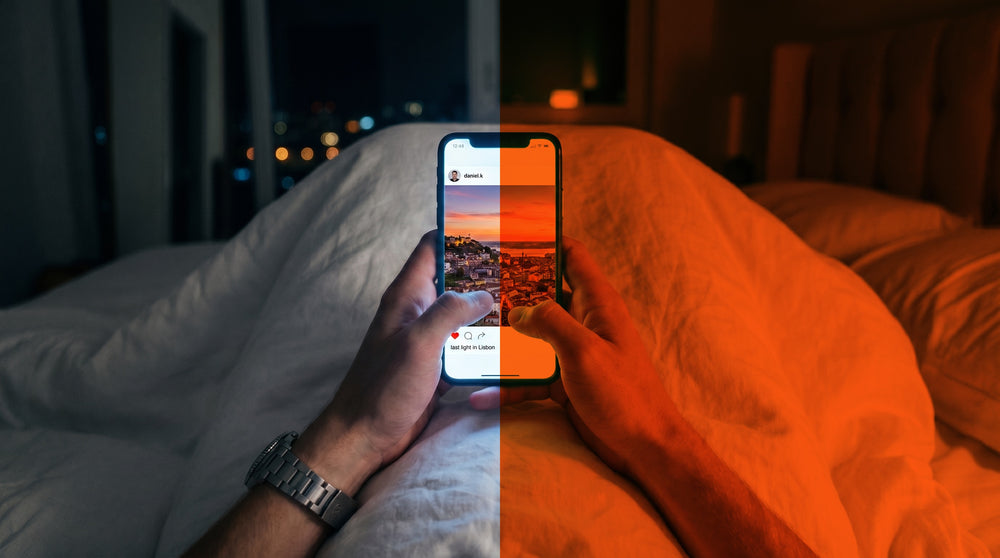 A phone used in bed shown half normal and half through the red Night Lens