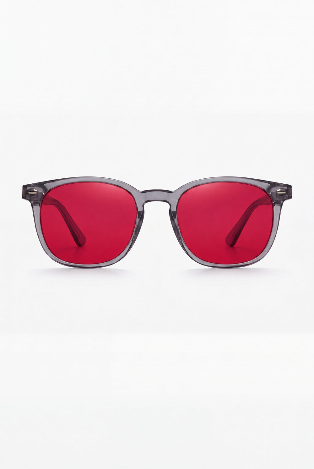 Wavelength Night Lens — red-tint blue light glasses, front view on white