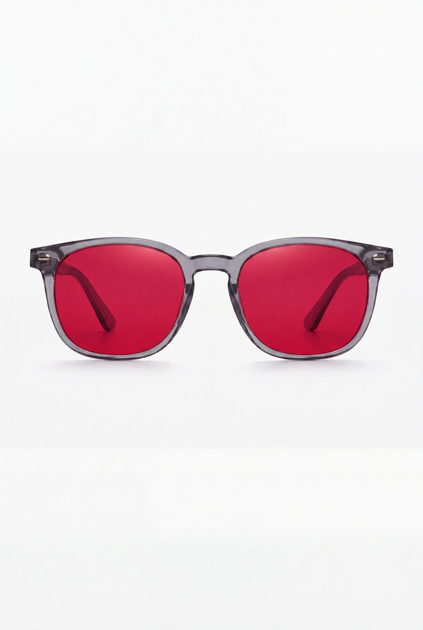 Wavelength Night Lens — red-tint blue light glasses, front view on white