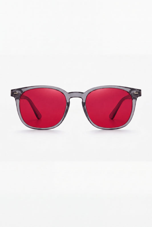 Wavelength Night Lens — red-tint blue light glasses, front view on white