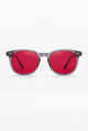 Wavelength Night Lens — red-tint blue light glasses, front view on white