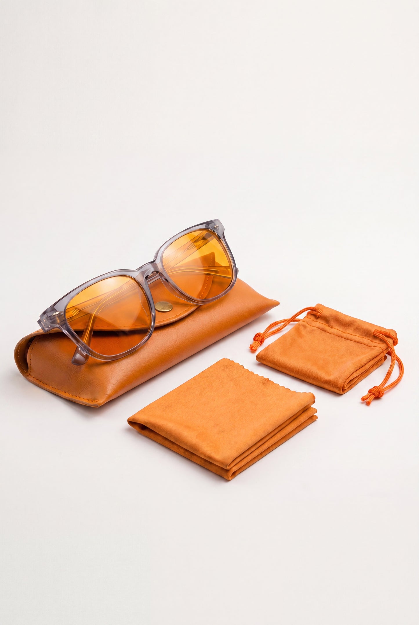 Wavelength Evening Lens with its tan leather case, drawstring pouch and microfiber cloth
