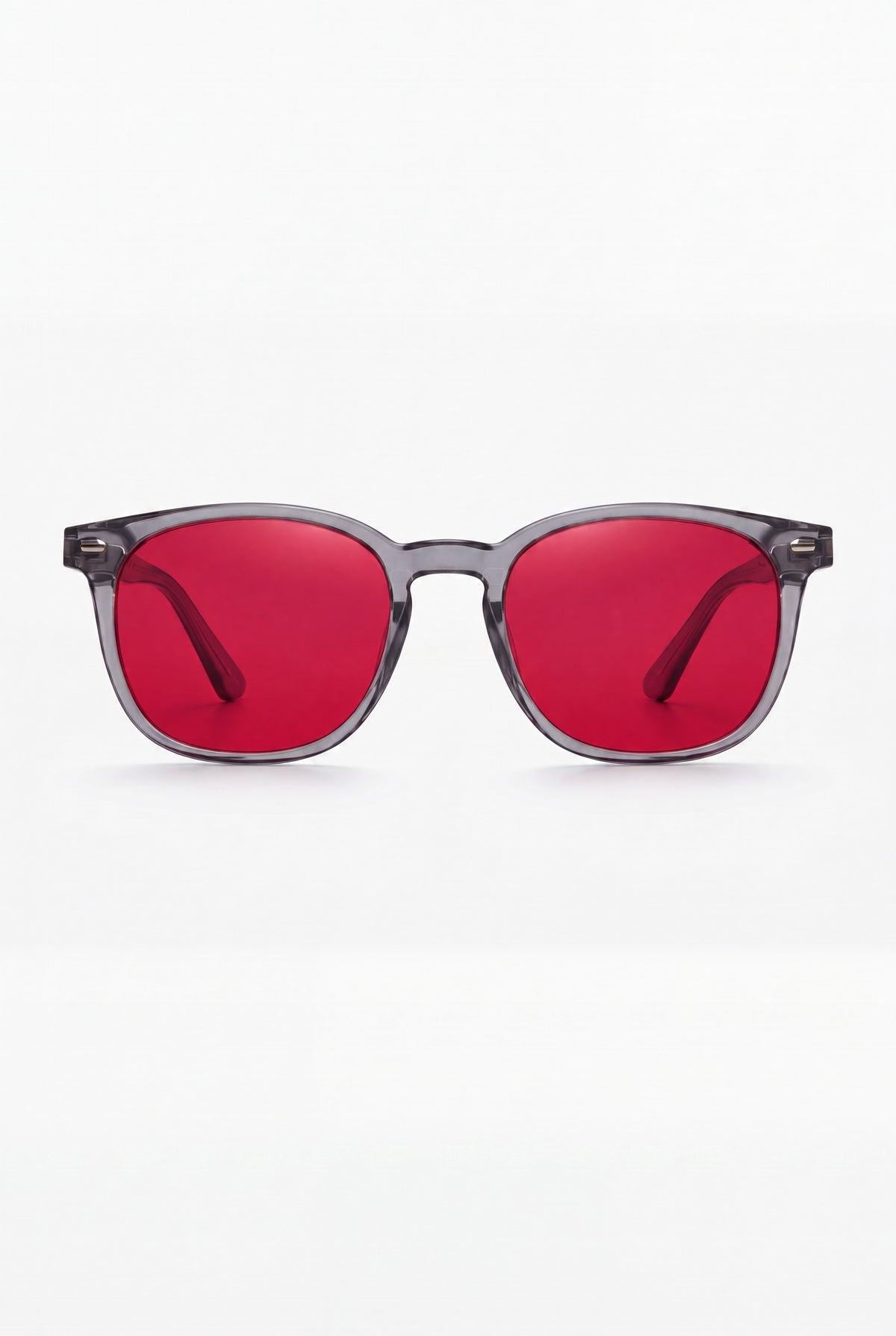 Wavelength Night Lens — red-tint blue light glasses, front view on white